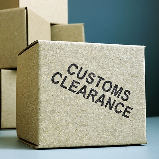 Box stamped with customs clearance — customs brokerage & compliance