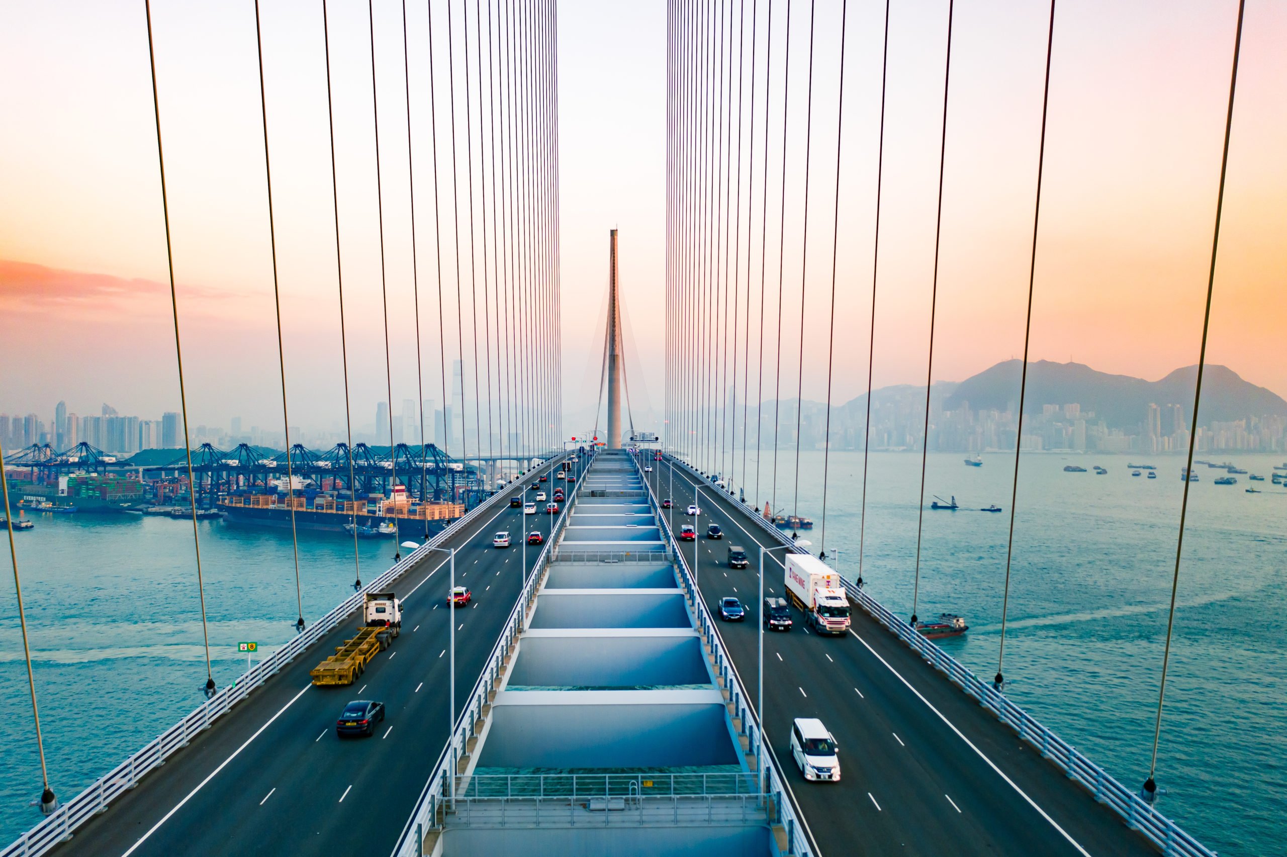 Drone view of Stonecutters Bridge and the Tsing sha highway at sunset