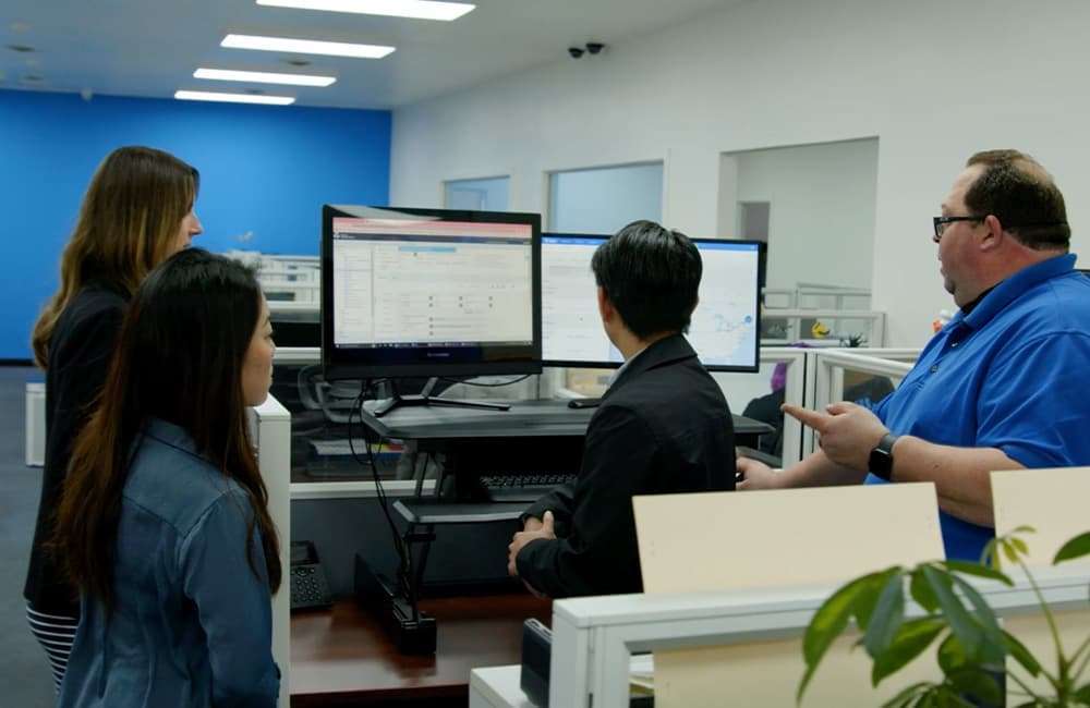 dock workers reviewing cargo