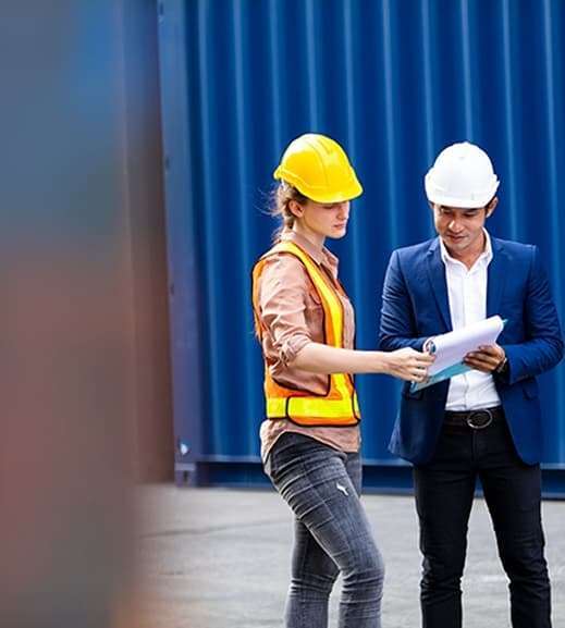 dock workers reviewing cargo